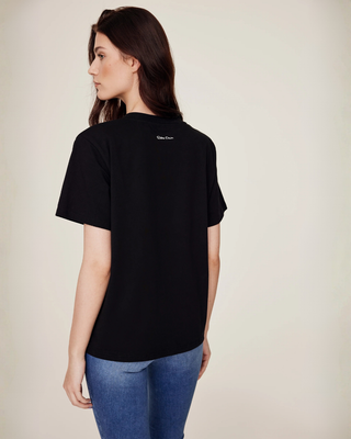 Angled back view of the black t-shirt highlighting the sleeve cut and comfortable equestrian fit.