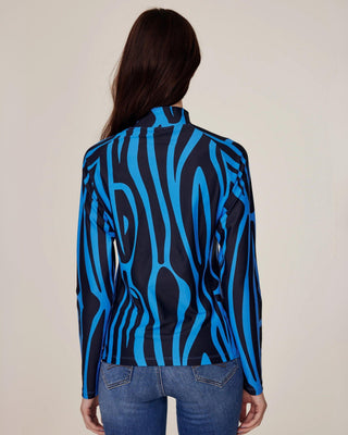 Full back view of the blue zebra equestrian top, highlighting the elegant high collar and nice length for a dressed-up look.