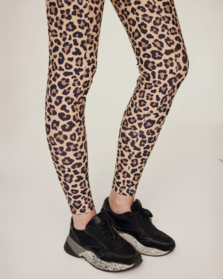 Detailed shot of the elastic ankle cuffs on the leopard breeches, designed for a smooth fit under riding boots.