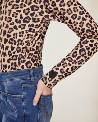 Detailed shot of the sleeve on the leopard riding top featuring the Riders Denim logo.