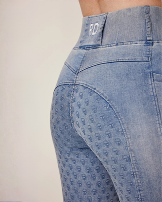 Detailed back view of the light blue breeches showing the RD logo, wide waistband, and skull silicone full seat grip.