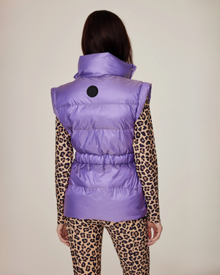 Detailed back view of the lilac puffer vest, showing the quilted semi-glossy fabric and athletic fit.
